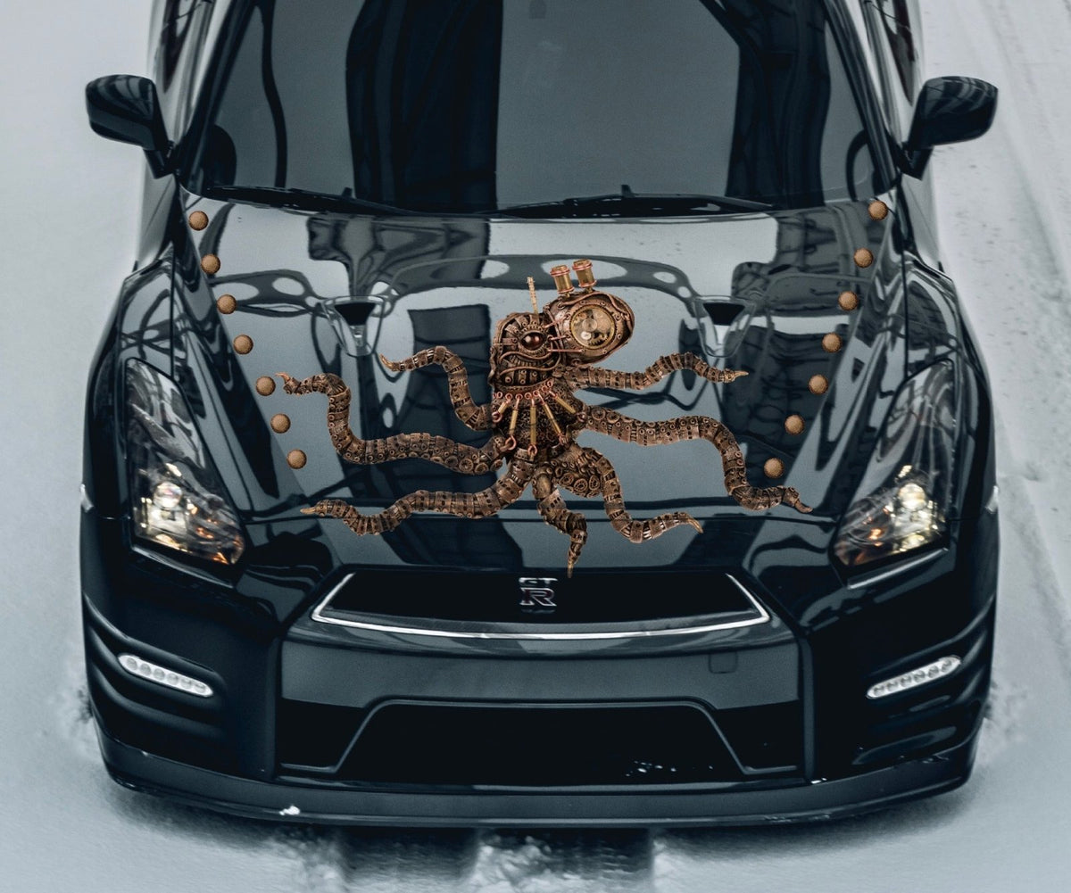 A black car with a Steampunk Octopus Decal by CoverAlls featuring a Halloween themed design on the hood.