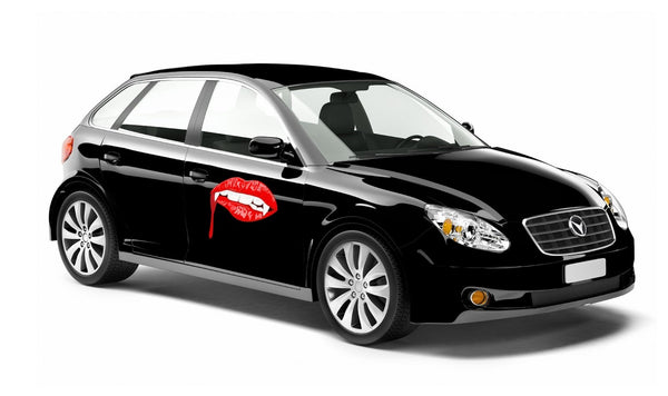 Black sedan with glossy finish, featuring detailed Cover-Alls vampire lip decals on the driver's door, displayed on a plain white background.